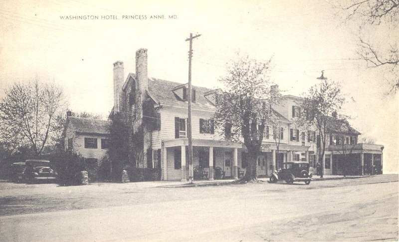 Washington Hotel in Princess Anne, sepia image of three story building with porch, forground is a dirt lane Washington Hotel in Princess Anne, sepia image of three story building with porch, forground is a dirt lane