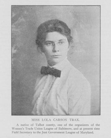 black and white image of a woman wearing wire rimmed glasses in a white collared shirt with a dark bowtie. Identified as Lola Carson Trax black and white image of a woman wearing wire rimmed glasses in a white collared shirt with a dark bowtie. Identified as Lola Carson Trax